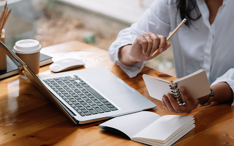 graduation cap and diploma with award representing educational achievement and three stages of education